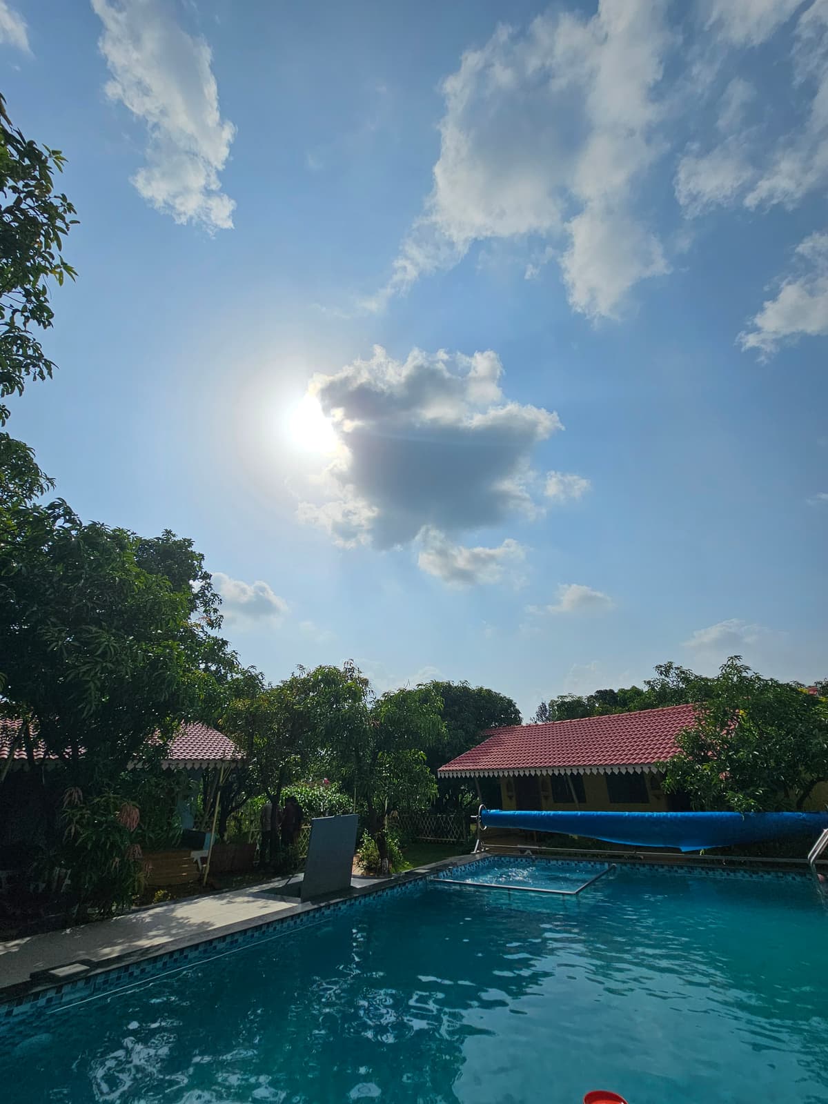 Infinity pool and cottage view at SwapnaKiran farm resort near Trimbakeshwar Nashik