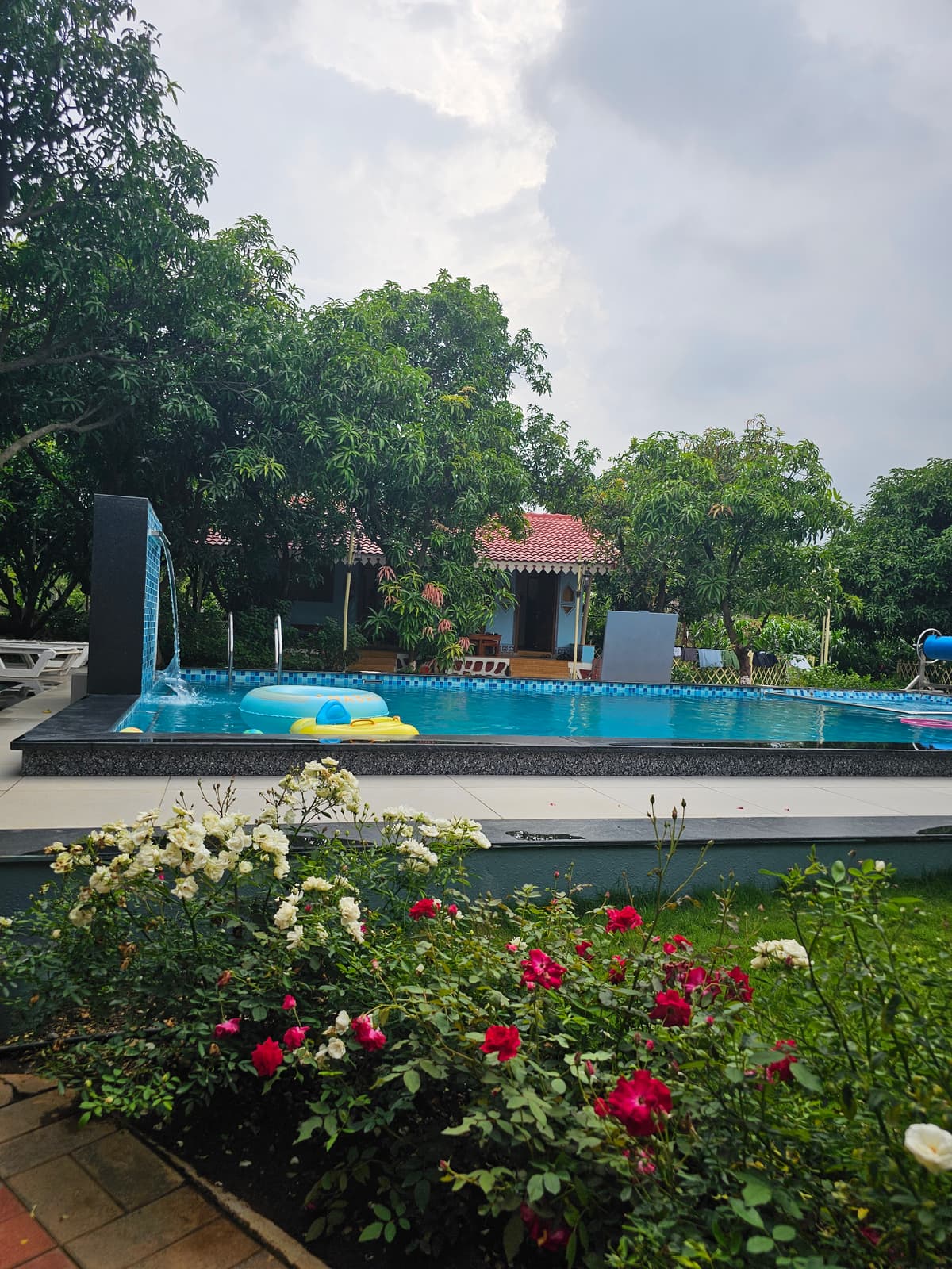 Flower garden and pool at SwapnaKiran nature resort Nashik
